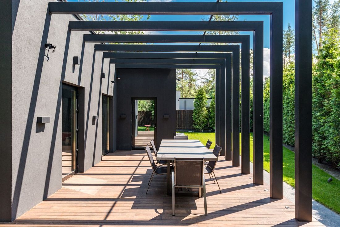 Modern pergola over an outdoor dining table