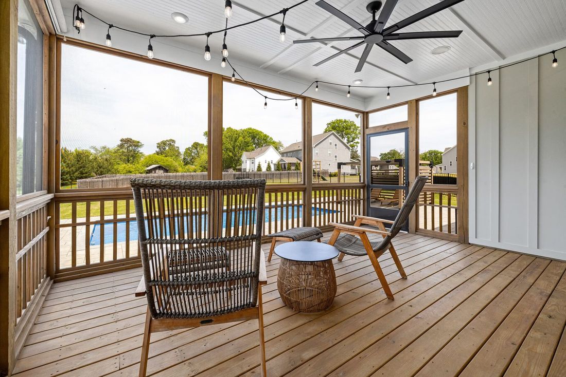 Screened porch overlooking a lake